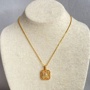 Avon Signed NWT Gold Tone Necklace Clear Rhinestone Studded Pendant